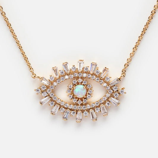 The CZ Evil Eye with Opal Center Necklace by Tai Jewelry features a delicate chain and an eye-shaped pendant with a central opal stone, surrounded by sparkling cubic zirconia accents.