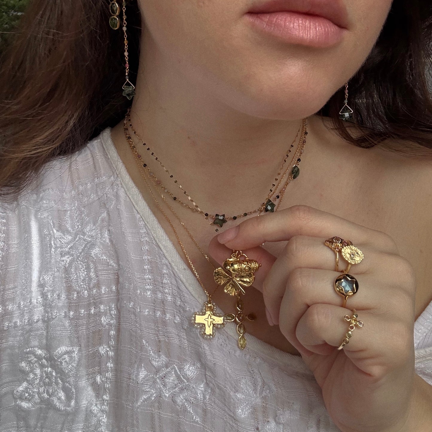 Karana Necklace being worn in a necklace stack