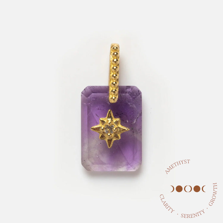 The Solid Gold Crystal Amulet Charm for Manifestation features a rectangular amethyst pendant with a gold dotted bail, a central gold star accent with a small gemstone, and Amethyst: Clarity, Serenity, Growth beneath a moon phase graphic.