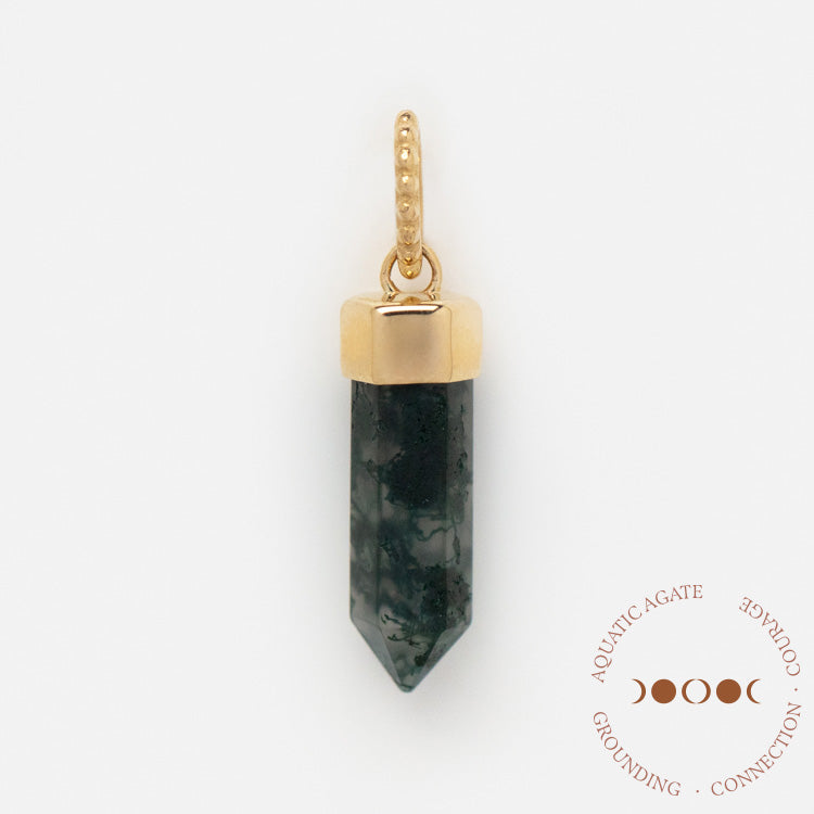 A Solid Gold Crystal Charm for Manifestation featuring a gold-capped moss agate pendant with a textured gold loop on a white background. “Aquatic Agate,” “Grounding,” and “Connection” with moon phase icons appear in the corner.
