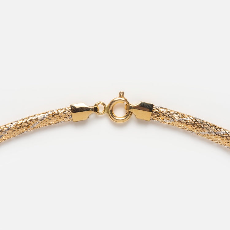 Close-up of the Solid Gold Mixed Metal Mesh Necklace, crafted in 14k gold with a textured design and spring ring clasp, shown on a plain white background.