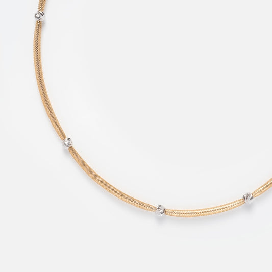 The Solid Gold Mixed Metal Mesh Beaded Necklace showcases five evenly spaced silver knot accents, blending gold and silver tones for a stylish mixed metal look, displayed on a plain white background.