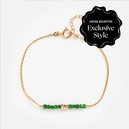 A Local Eclectic exclusive, the Camille Emerald Bracelet is a gold filled piece featuring vibrant green beads for a stunning emerald look.