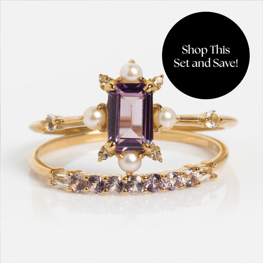 The Solid Gold 2025 June Capsule Alexandrite and Pearl Ring Set features an emerald-cut alexandrite, pearl and diamond accents, plus a curved band with purple stones. Includes a free gift. Shop This Set and Save! appears in a black circle.