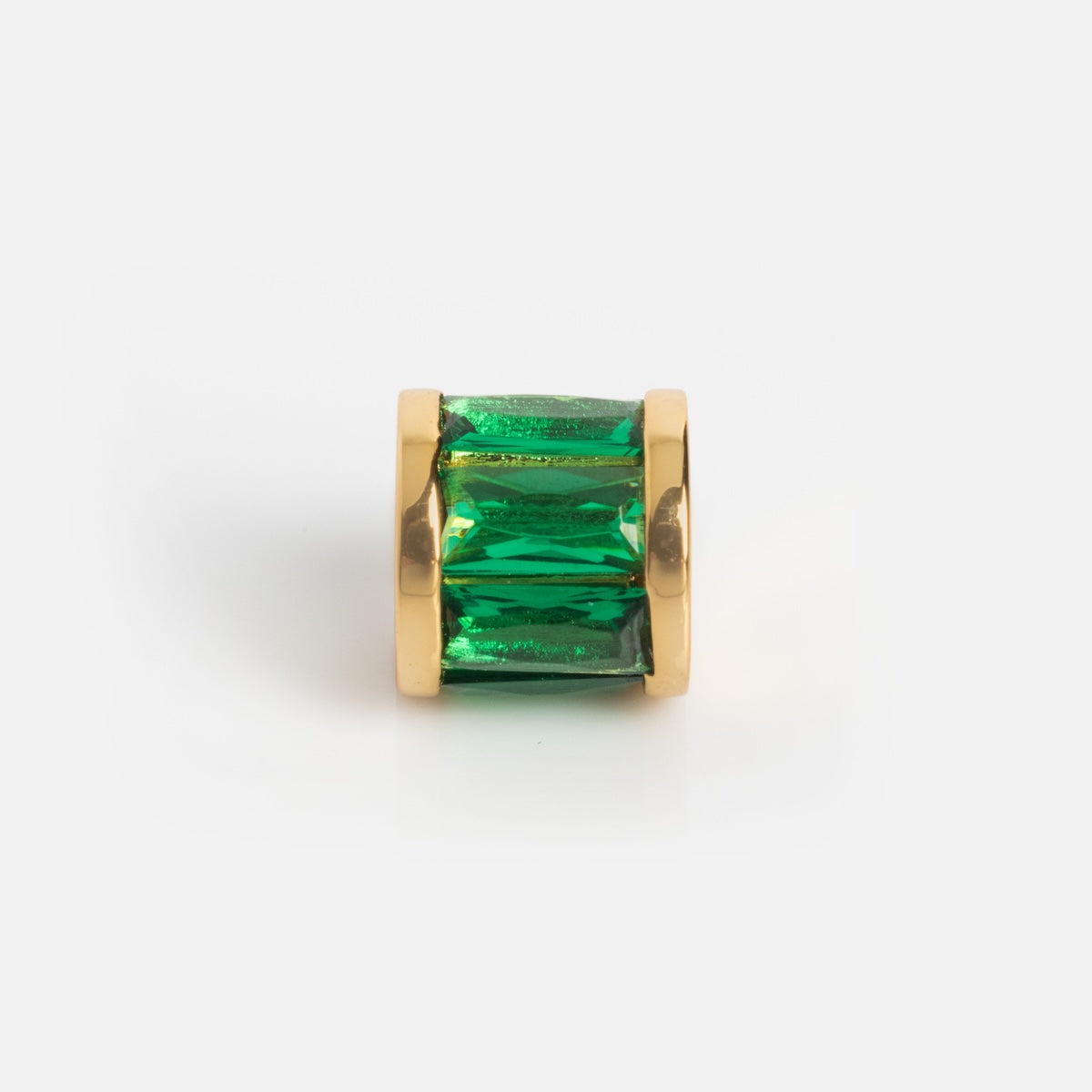 The Charms by Thatch gold ring showcases a large, emerald-cut green gemstone, elegantly displayed against a white background and perfectly paired with gold plated charms for added sophistication.