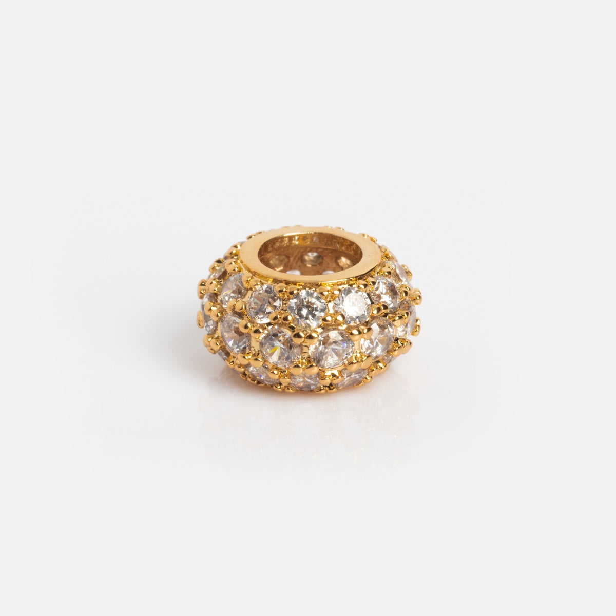 The Charms by Thatch bead is a round, gold-plated charm encrusted with small sparkling clear gemstones, shown on a plain white background.