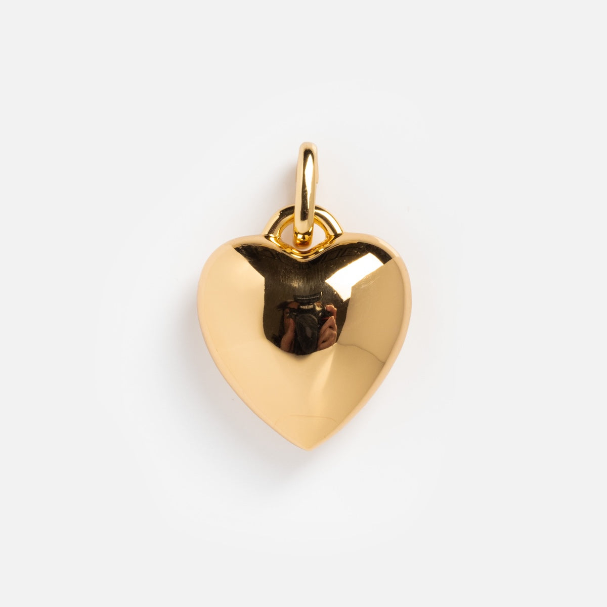 The Charms by Thatch gold-plated heart pendant features a shiny, smooth surface and a small top loop, elegantly displayed against a plain white background.