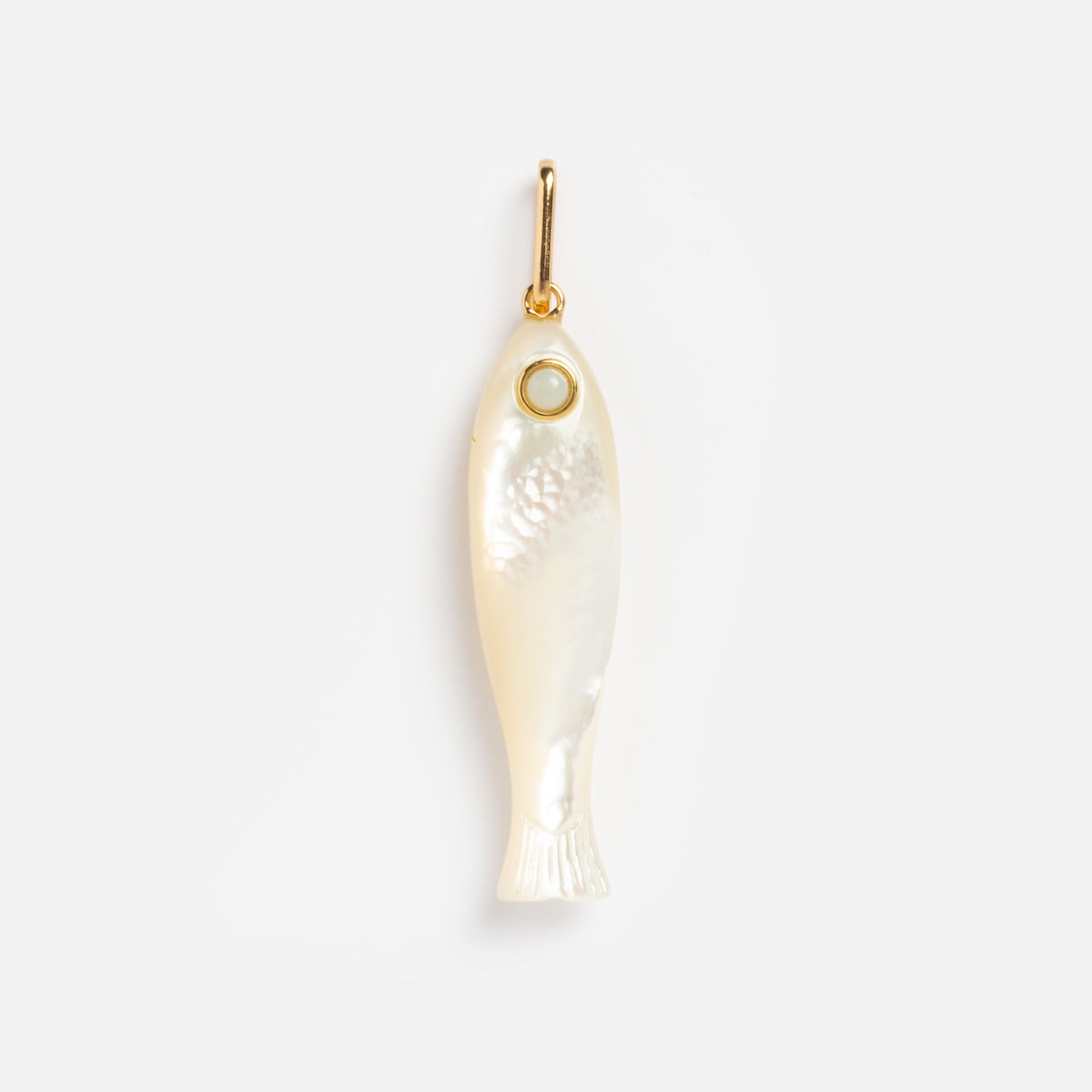 The Charms by Thatch pendant features a fish shape crafted from mother of pearl with a pearly, translucent finish, subtle scale details, a gold-accented eye, and a small gold ring—ideal for personalized necklace charms.
