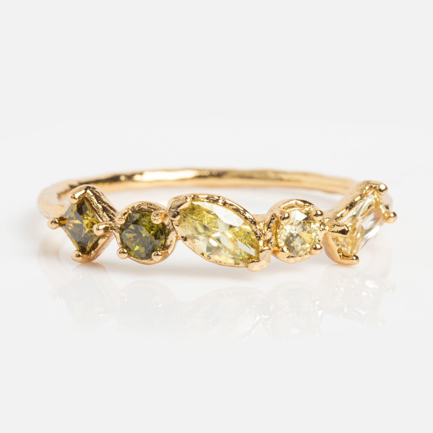 The Shades of You Ombre Birthstone Ring showcases five yellow and green gemstones in unique shapes on a delicate 14k gold plated band, presented against a white background.