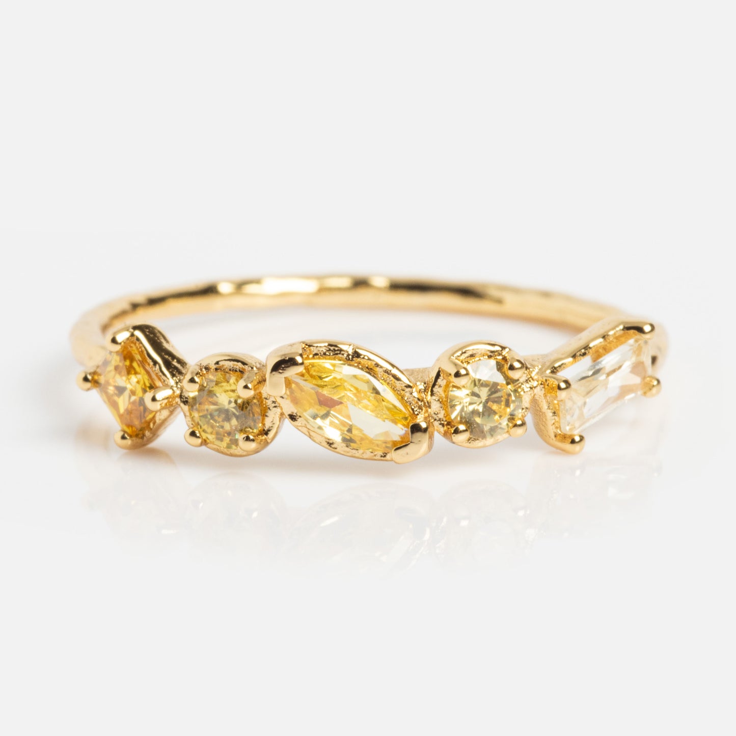 The Shades of You Ombre Birthstone Ring is 14k gold-plated, features four gemstones in round and marquise cuts with yellow and clear hues, all shown on a white background.