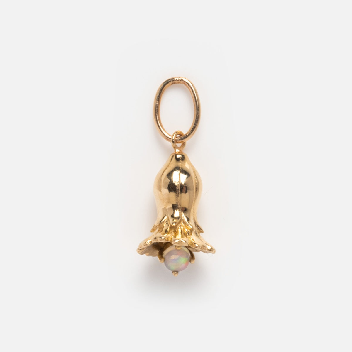 The Solid Gold Birth Flower Bud Charm features a gold flower-shaped pendant with rounded petals and a central iridescent bead, attached to a gold oval loop—ideal as personalized jewelry. Shown on a plain white background.
