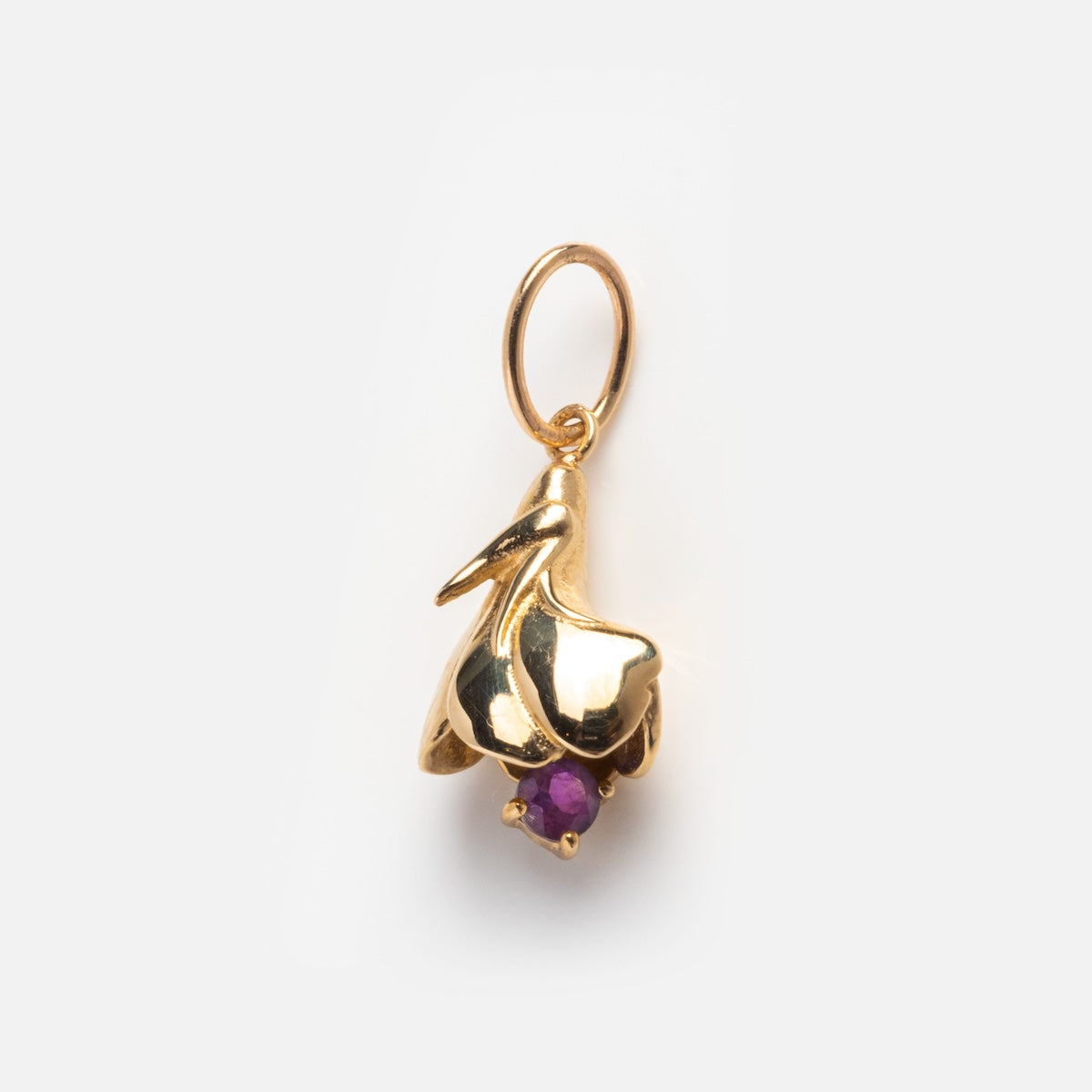 The Solid Gold Birth Flower Bud Charm, shown against a plain white background, is a delicate pendant perfect as a birthstone keepsake or for anyone seeking personalized jewelry.