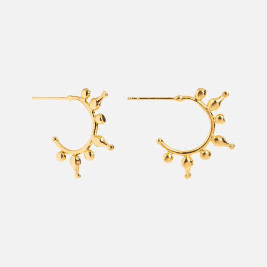 The Jale Gold Hoop Earrings are 21k gold plated Bohemian hoops featuring small, round ball accents evenly spaced around the edge, shown against a plain white background.