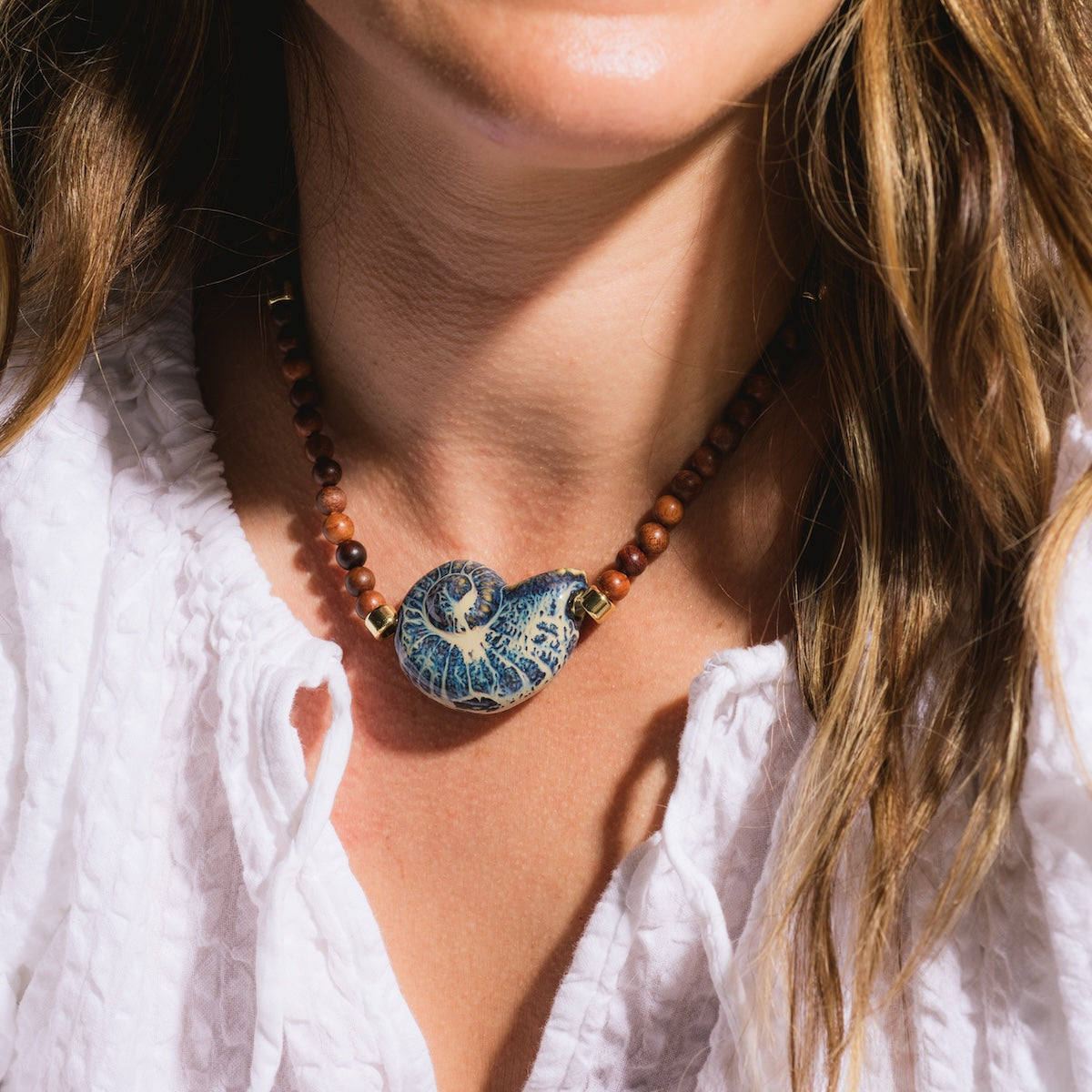 Close up of model wearing Edith Barbarella Cove Necklace
