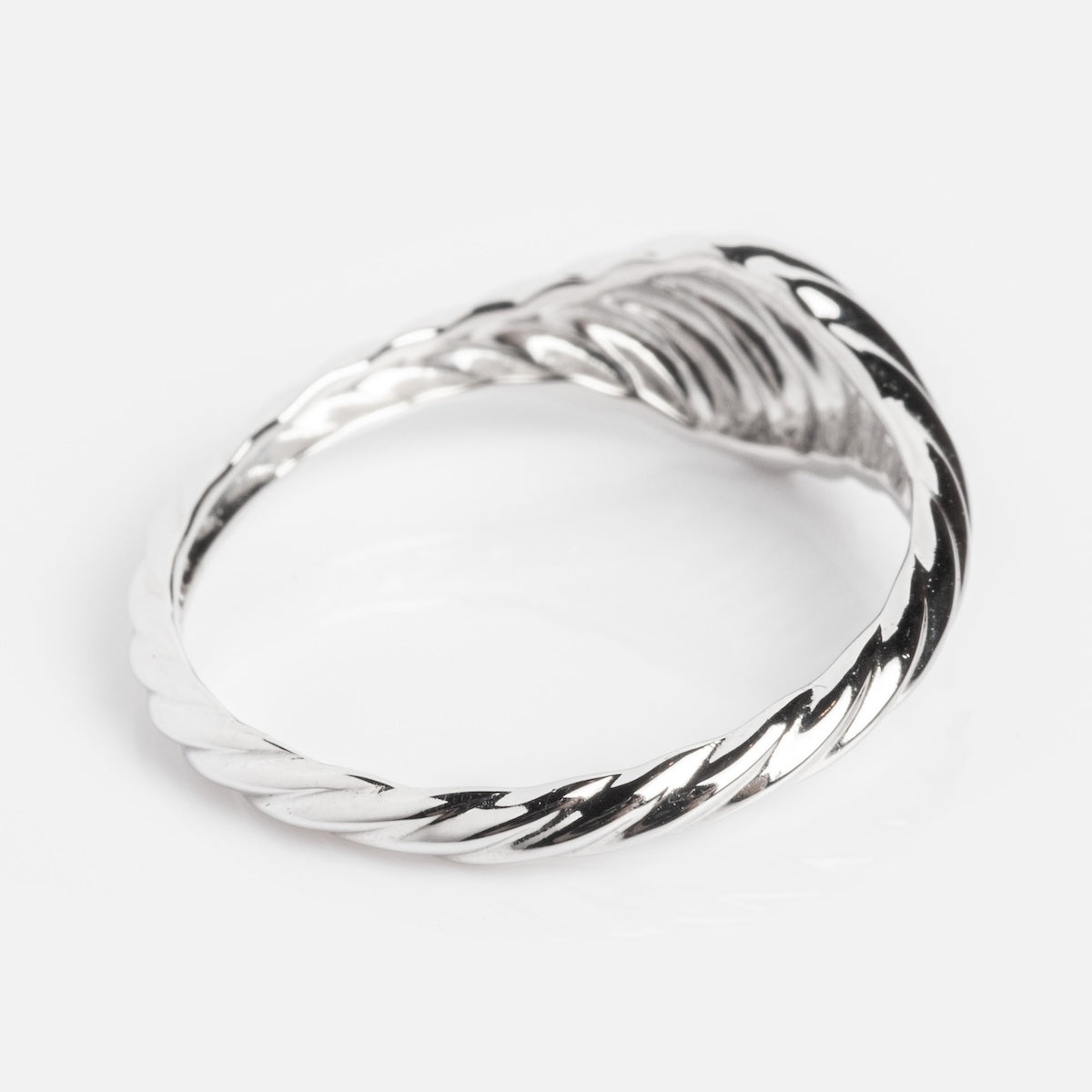 A Solid Gold Twisted Signet Ring with a rope-like design, vintage-inspired and elegantly displayed on a white background.