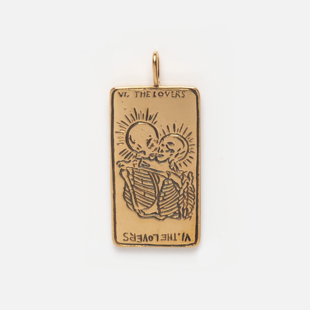The Tarot Card Charm is a 14k solid gold pendant engraved with two skeletons embracing under VI. The Lovers and sun rays, creating a unique piece of spiritual jewelry.