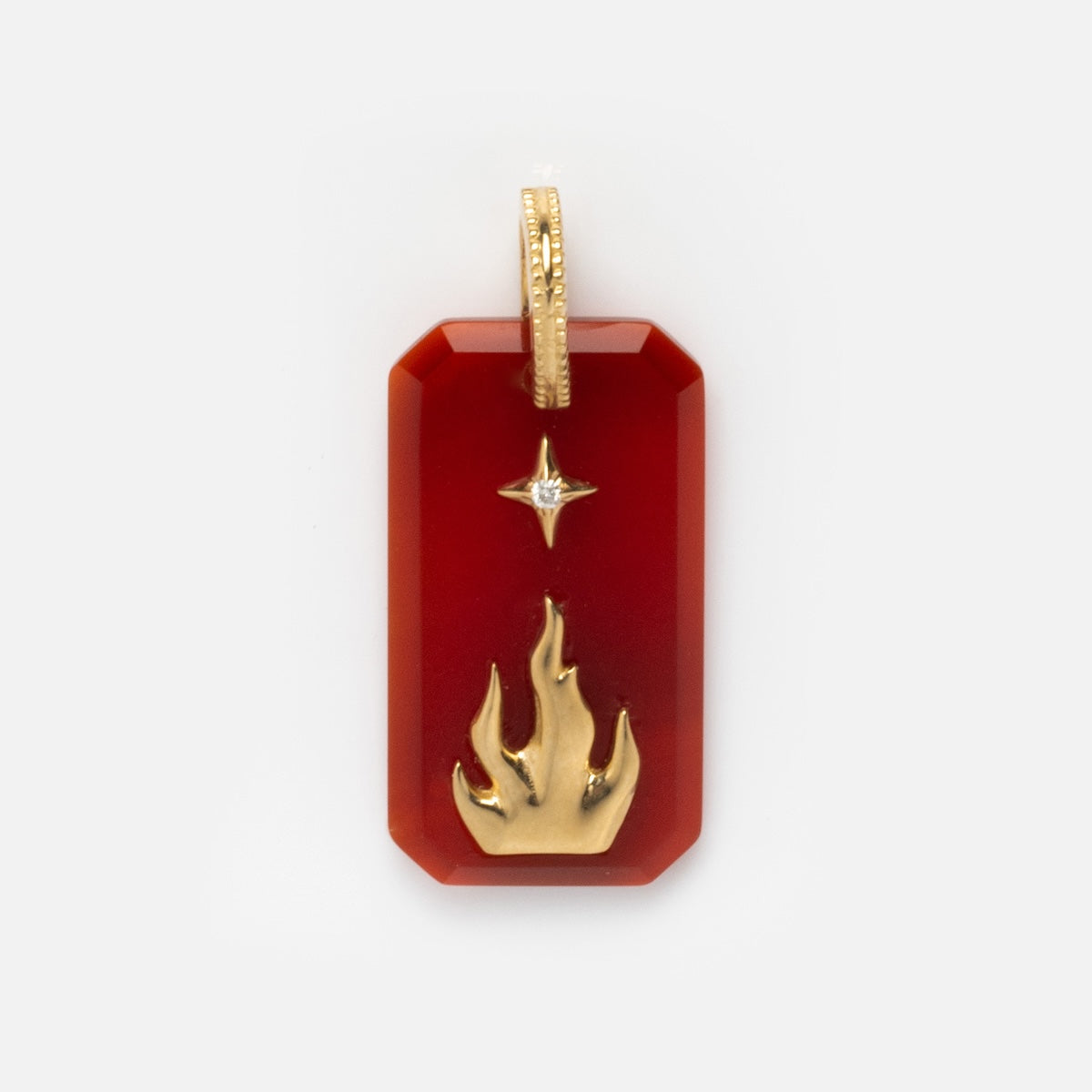 The Solid Gold Crystal Element Charm is a rectangular red pendant with beveled edges, featuring a gold flame and a small gold star above it, crafted in solid gold with a bail for attaching to a chain.