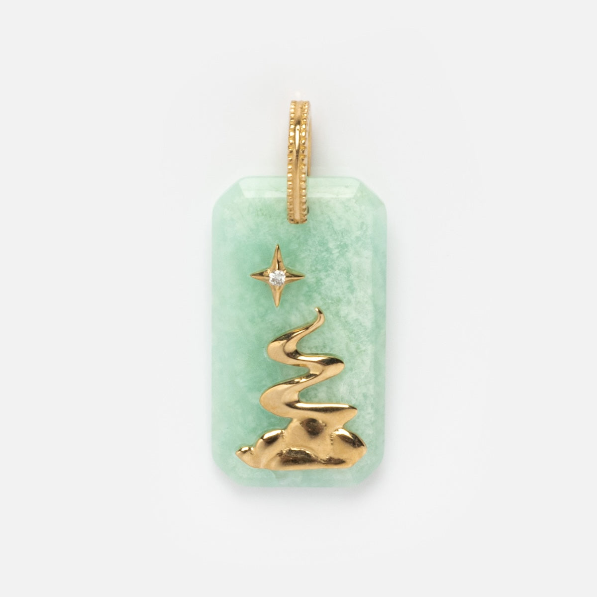 The Solid Gold Crystal Element Charm features a rectangular light green natural crystal pendant with a gold spiral tree, a small star above it, and a gold loop at the top for attaching to a necklace.