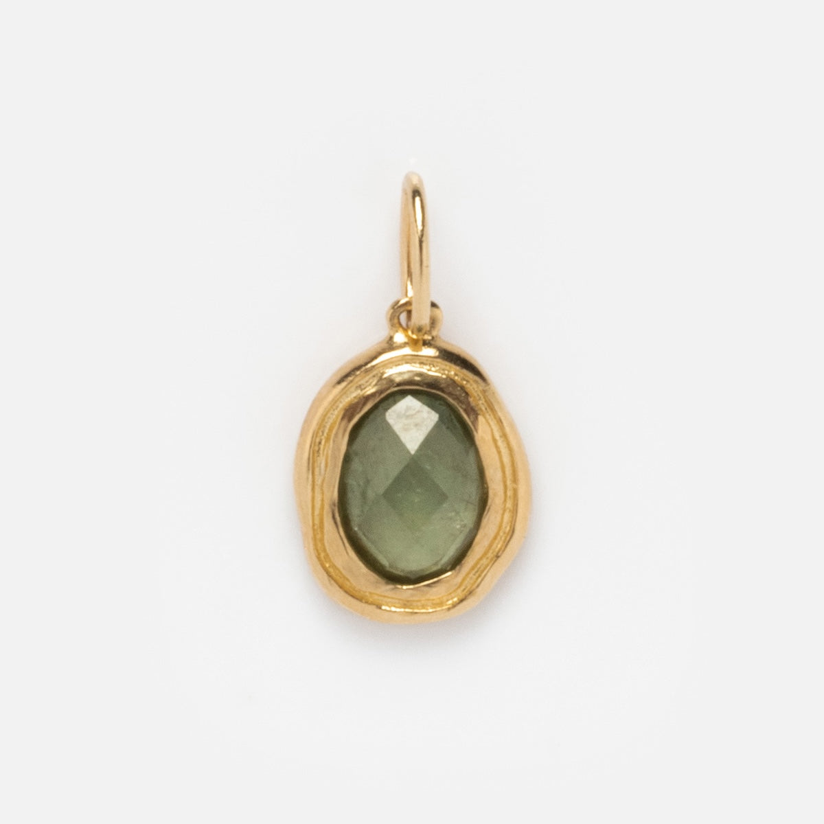Solid Gold Amulet Charm: an exclusive necklace with an irregular oval gold frame and a green faceted gemstone center, showcased against a plain white background.