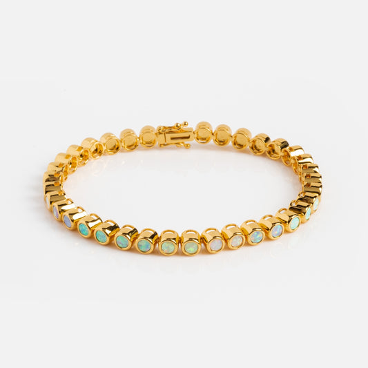 The Pastel Opal Ombre Tennis Bracelet features a row of pastel opals in individual gold vermeil bezels, shown against a plain white background.