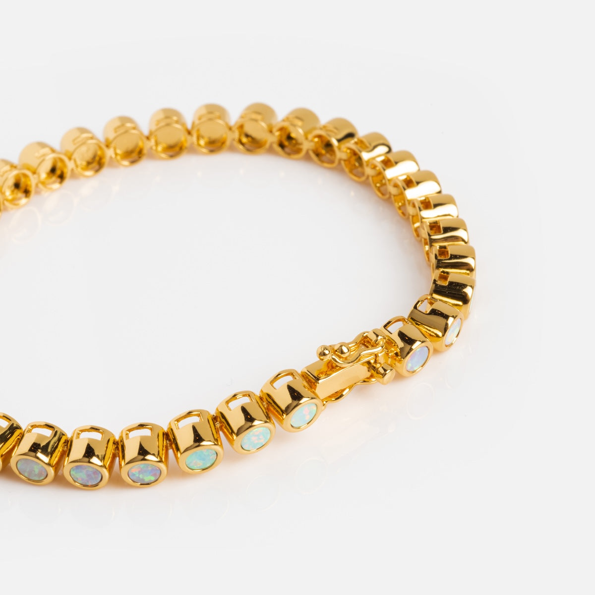 The Pastel Opal Ombre Tennis Bracelet features oval links, each adorned with a small pastel opal gemstone, shown on a white background.