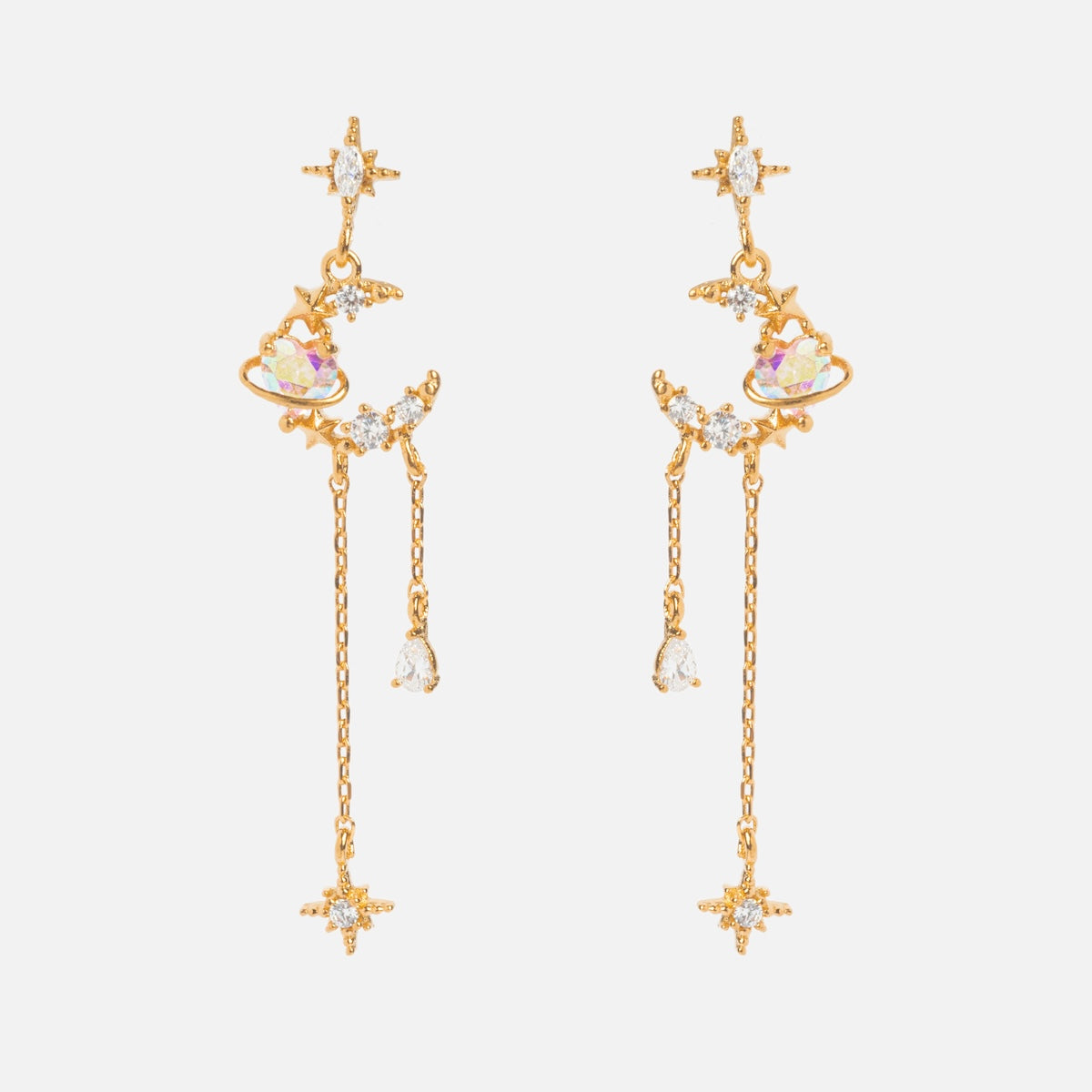 The Moonbeam Dangle Earrings Sample features star and planet designs with sparkling crystals, iridescent accents, CZ stones, sterling silver posts, two chains of different lengths, and delicate star-shaped details at the ends.