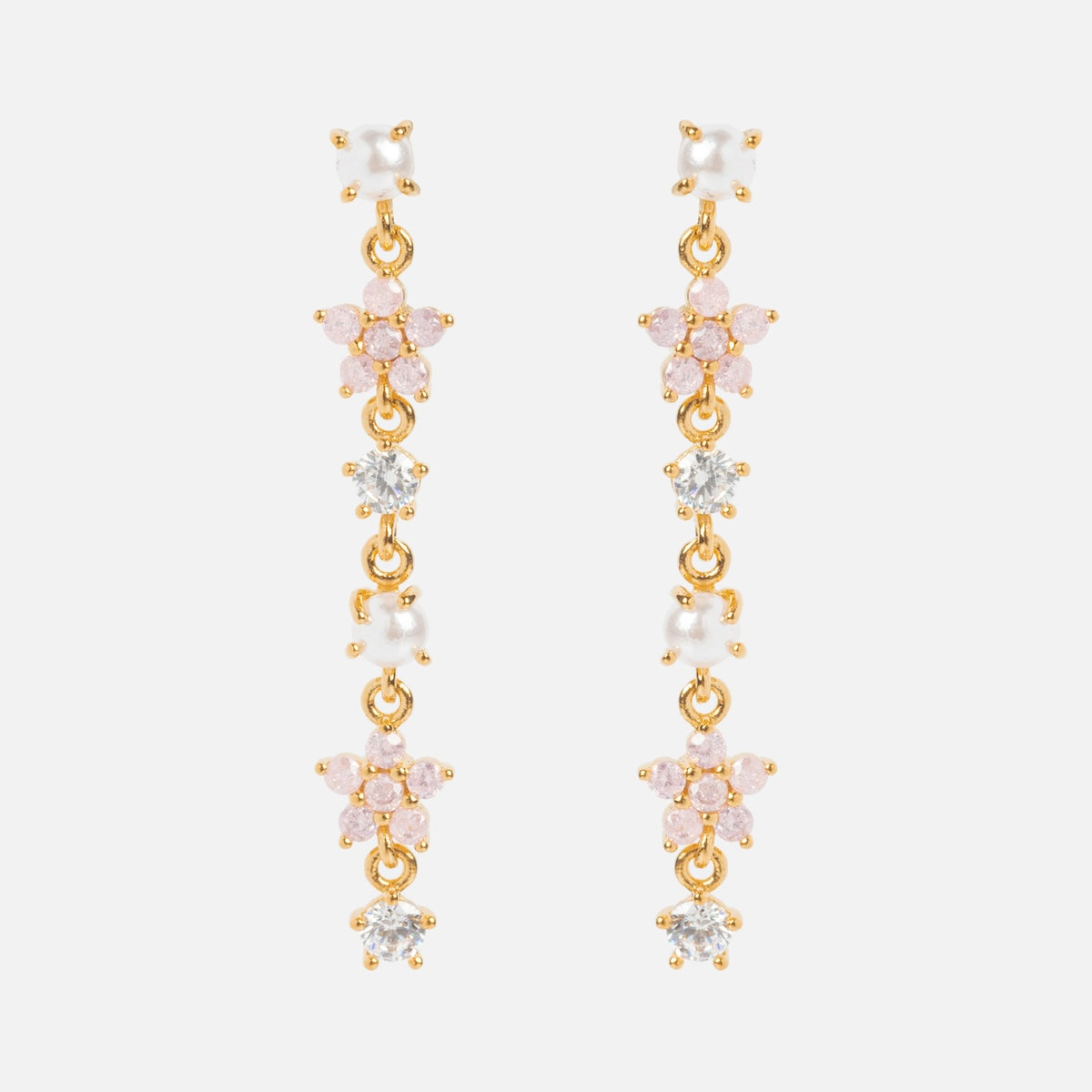 The Pearl Petals Dangle Earrings Sample showcases gold drop earrings with pink, white, and clear CZ stones in a floral pattern on sterling silver posts, set against a white background.