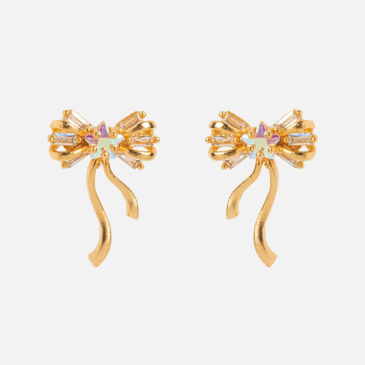 Coquette Bow Earrings Samples: Gold bow-shaped earrings with CZ gemstone accents, dangling ribbon-like tails, 18k gold-plated finish, and sterling silver posts. Displayed on a plain white background.