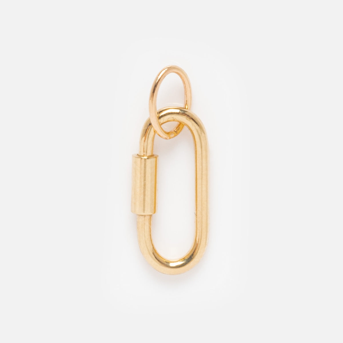 The Solid Gold Charm Clip is an oval-shaped gold charm with a clip clasp and a small round loop at the top, ideal for attaching to bracelets. Displayed on a plain white background.