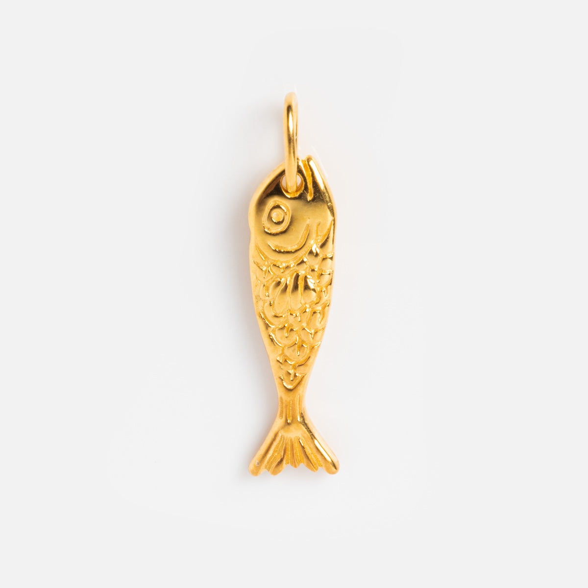 The Charms by Hunt of Hounds features a gold vermeil fish-shaped pendant with engraved scales and intricate details, hanging from a small loop against a plain white background.