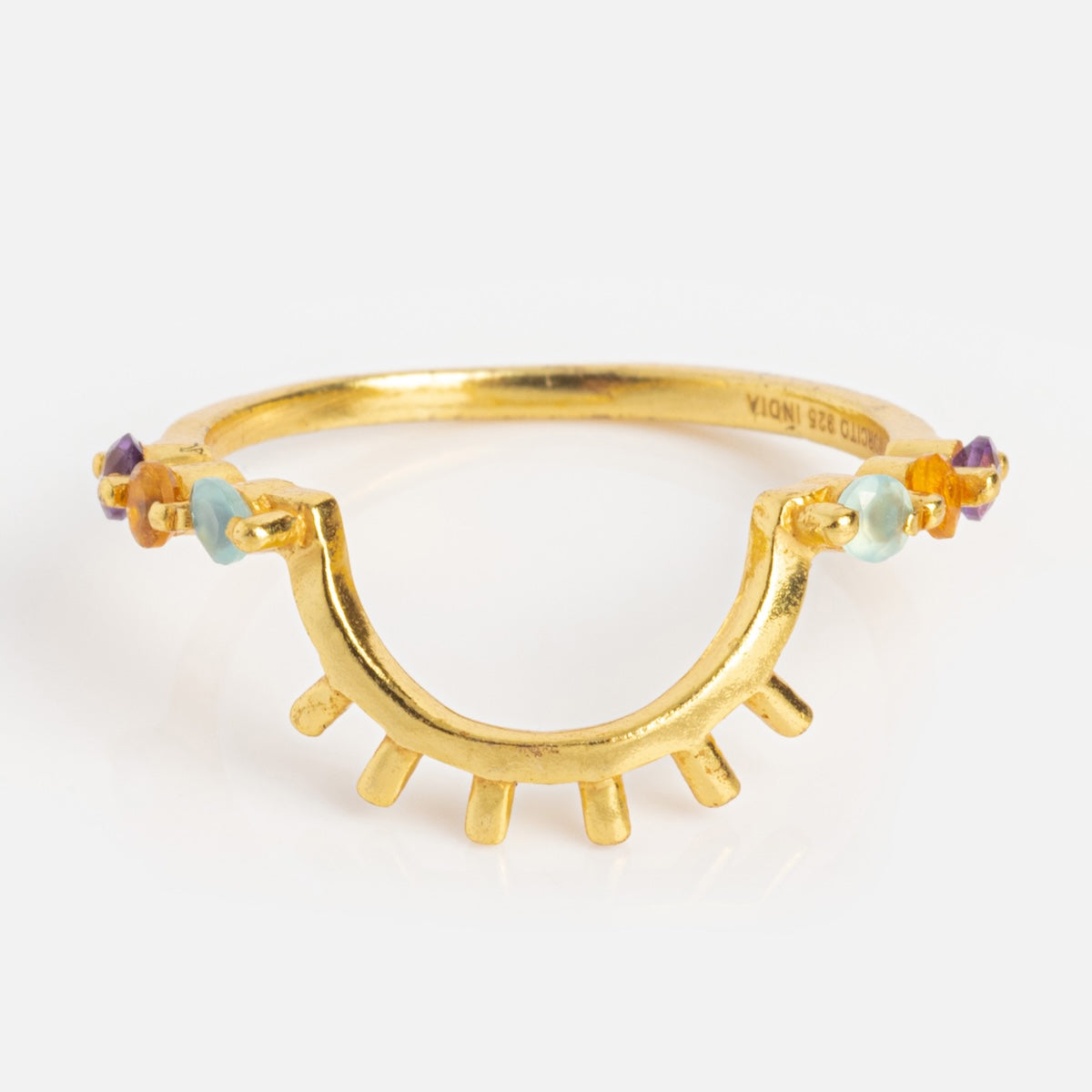 The Sunbeam Ring Sample Size 6 features a unique abstract eye design with amethyst and blue gemstone accents set around an 18k yellow gold plated band and radiating gold prongs at the base.