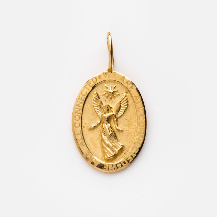 The Solid Gold Coin Charm, exclusive to Local Eclectic, features an engraved angel and star at its center, “ALL CONNECTED” around the border, and a small loop at the top for attaching to a chain.