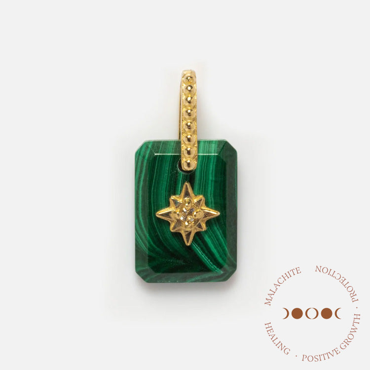 Solid Gold Crystal Amulet Charm for Manifestation: features a rectangular green malachite pendant with a gold starburst, gold-studded bail, and engraved with “Malachite Protection Healing Positive Growth.”.