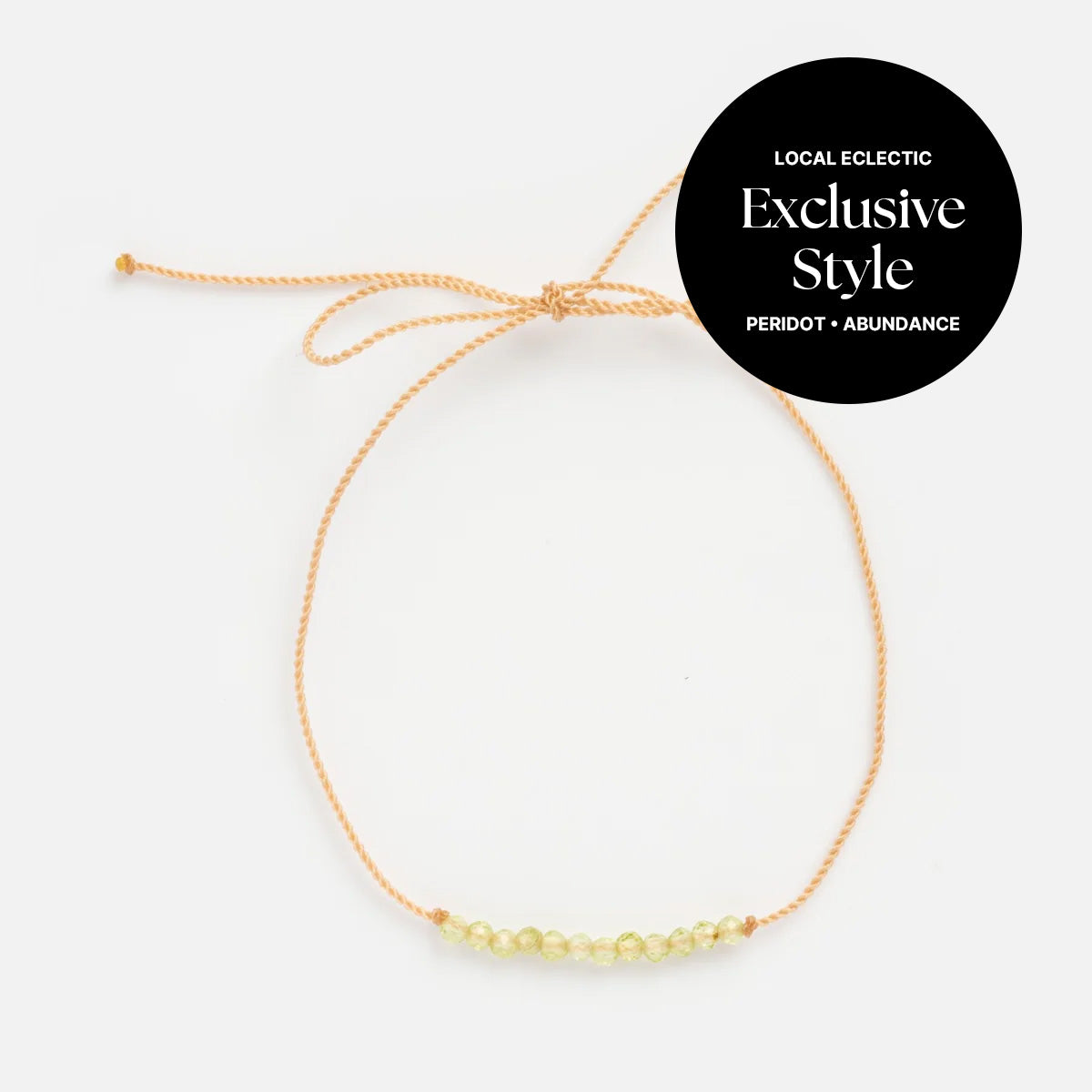 The Anokhi Green x Local Eclectic Gemstone Wish Bracelet features a peach adjustable cord and light green peridot gemstones—an exclusive piece designed to bring meaning and abundance to your everyday style.