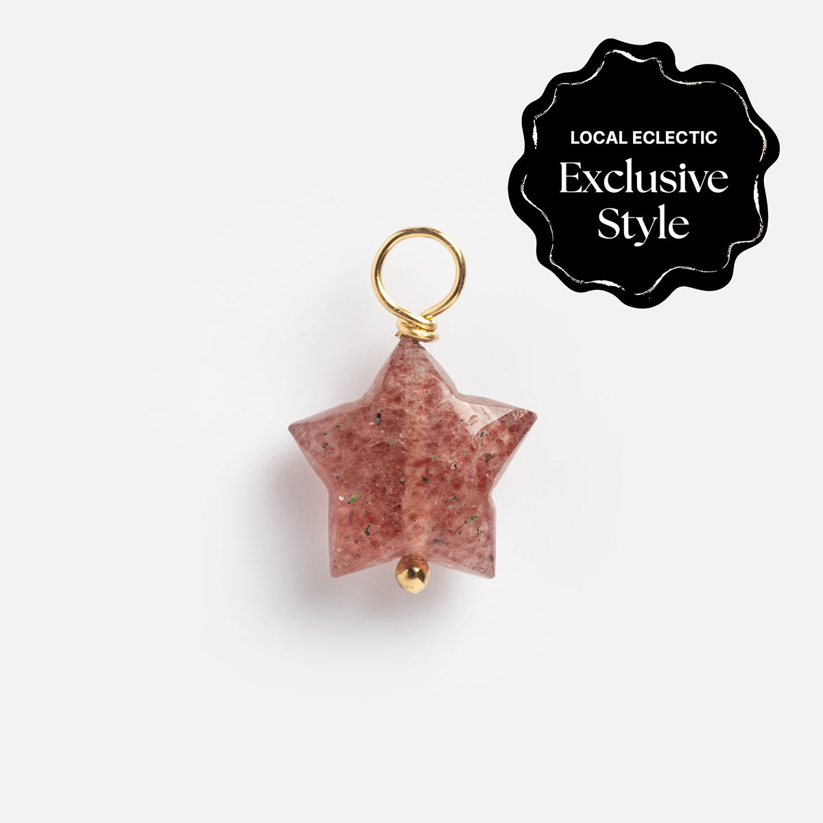 The Devi Arts Collective x Local Eclectic Carved Crystal Charms feature a pink, star-shaped crystal with a gold loop and bead, shown on a white background with a Local Eclectic Exclusive Style label. Ideal for semi-precious stone jewelry lovers.