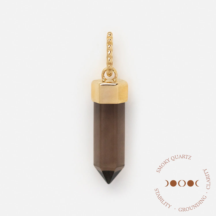 The Solid Gold Crystal Charm for Manifestation, featuring a gold-capped smoky quartz pendant, is shown on a white background. Text reads “Smoky Quartz: Stability, Grounding, Clarity” with crescent moon art—ideal for manifesting.