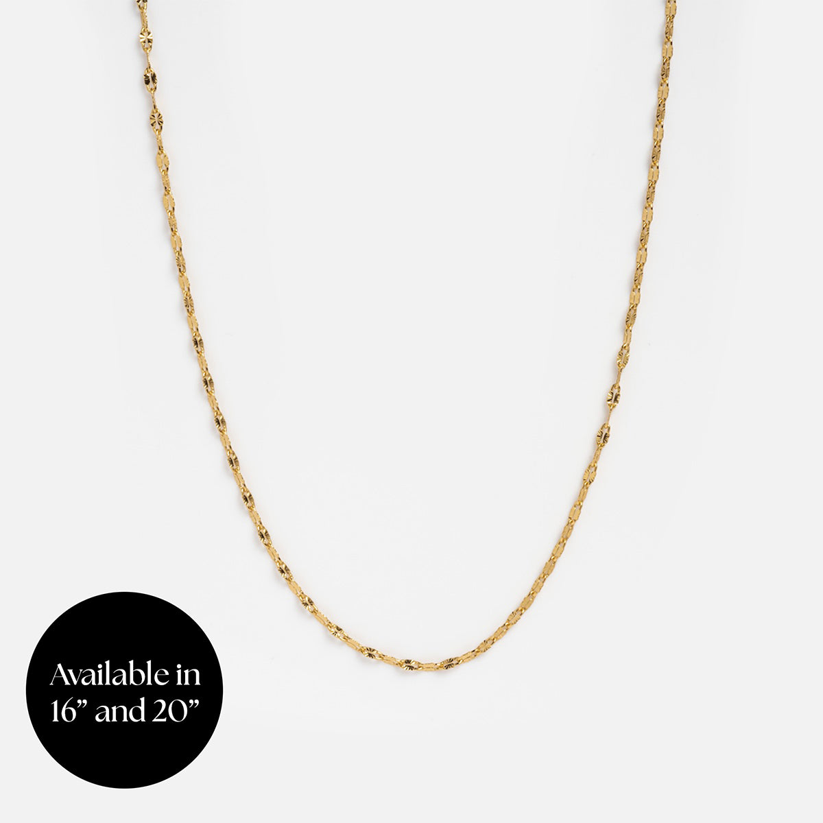 A delicate Chain For Charms necklace is shown on a plain white background, with a black circle in the corner stating, Available in 16 and 20.