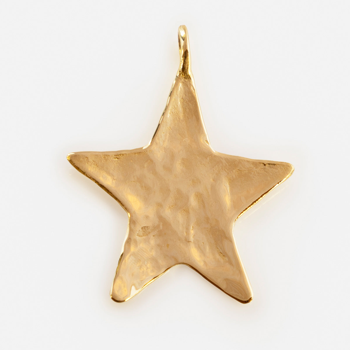 A hammered gold star-shaped pendant with a top loop, from the Luiny x Local Eclectic Charms collection, showcased on a plain white background—a stunning piece of jewelry.