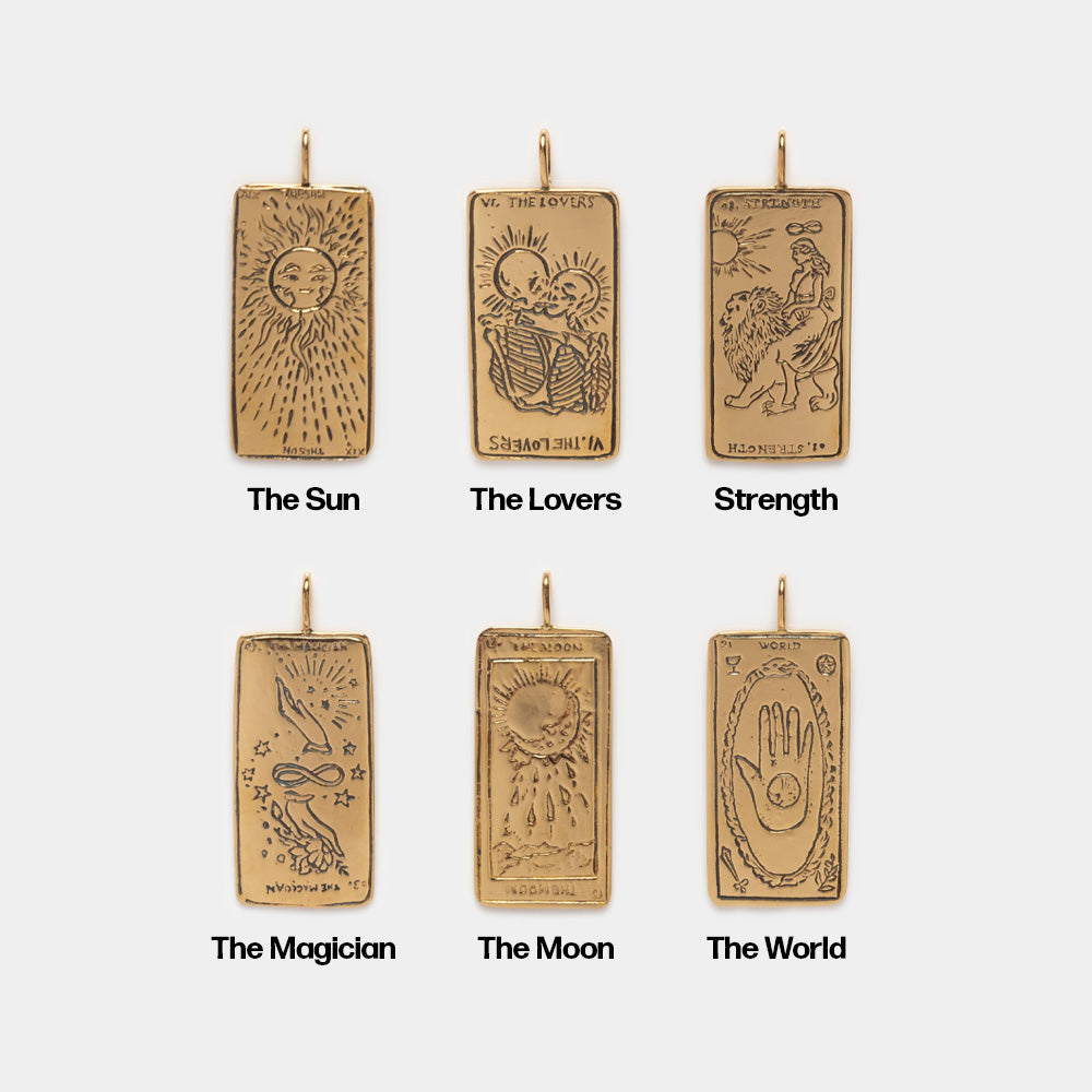 Six gold Tarot Card Charm necklaces feature engraved rectangular pendants with detailed illustrations and titles of The Sun, The Lovers, Strength, The Magician, The Moon, and The World for a unique spiritual jewelry touch.