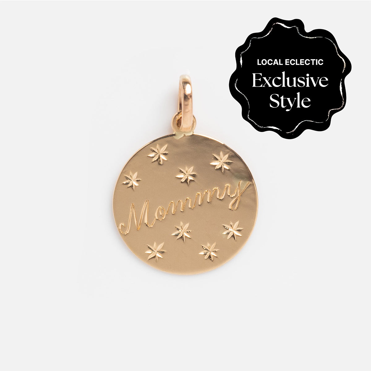 The 14k Written in the Stars Customizable Name Charm features “Mommy” engraving, star accents, and a necklace loop. A personalized jewelry piece, it’s a Local Eclectic Exclusive Style.