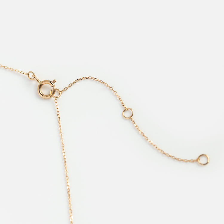 The Solid Gold Something Blue Aquamarine Necklace features a delicate chain with a spring ring clasp and three adjustable loops, shown on a white background—an elegant choice for refined wedding jewelry.