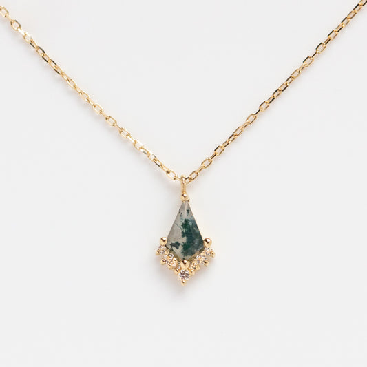 The Solid Gold Aquatic Agate Elements Kite Necklace features a greenish-teal natural agate gemstone in a geometric pendant with small clear stone accents, shown on a white background.