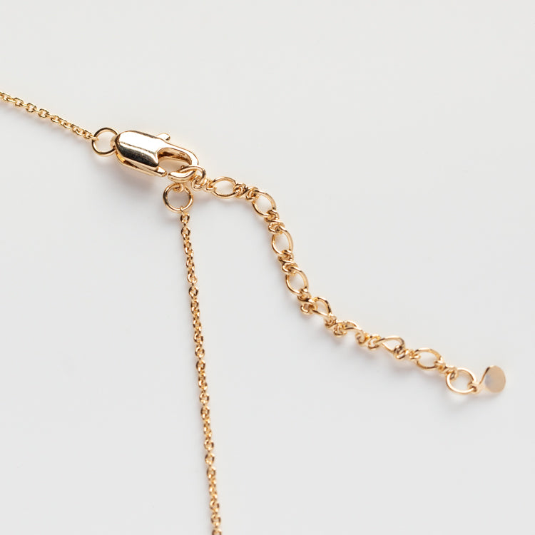 A close-up of the CZ Evil Eye with Opal Center Necklace, featuring a lobster clasp and an extender with small round links, displayed on a light, neutral background.