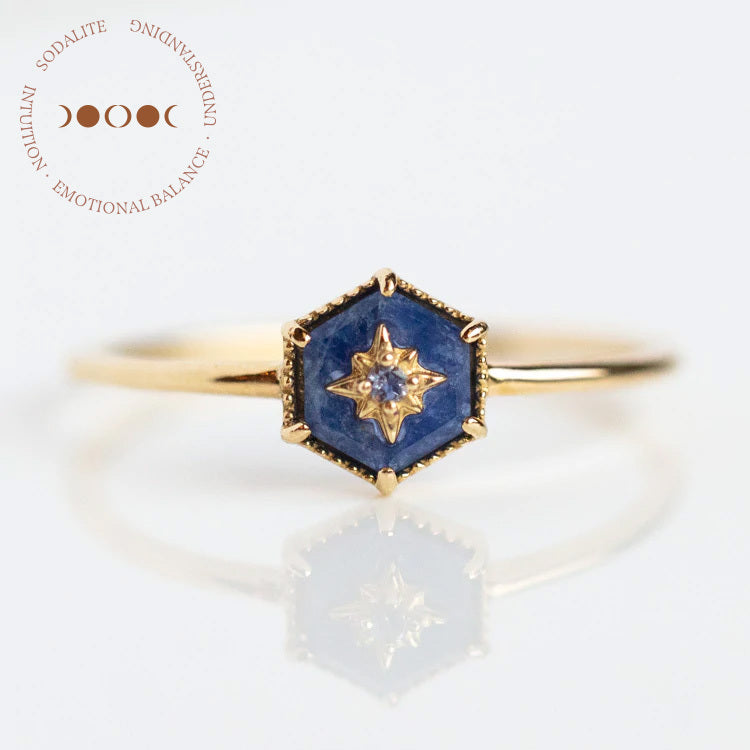 A Solid Gold Crystal Ring for Manifestation featuring sodalite, sample size 7, is displayed on a white background with circular descriptive text beside it.