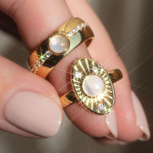 yellow gold moonstone rings on fingers
