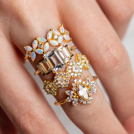 exclusive statement rings from La Kaiser with opals, moonstones, and white topaz