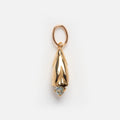 The Solid Gold Birth Flower Bud Charm features a small, gold pendant shaped like a downward-facing flower bud with a round light blue gemstone tip, shown against a white background.