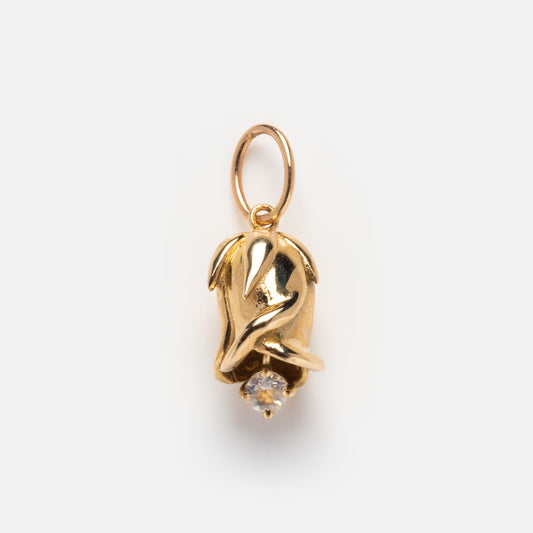 The Solid Gold Birth Flower Bud Charm is rosebud-shaped with a single clear gemstone at the base and a gold loop for attaching to a necklace or bracelet, displayed on a plain white background.