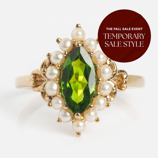 The 14k Opulent Green Diopside and Pearl Marquise Ring features a green marquise gemstone encircled by pearls. A burgundy circular label displays: The Fall Sale Event Temporary Sale Style.