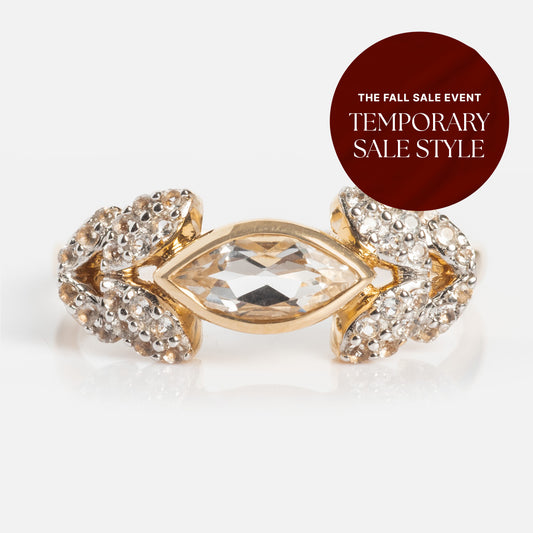 The 14k Vintage Inspired Laurel Crown Ring features a clear gemstone center, marquise details, and small round diamonds. A red label reads, The Fall Sale Event—Temporary Sale Style. This ring brings timeless elegance to any look.